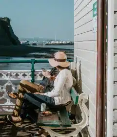 man and woman sitting on bench