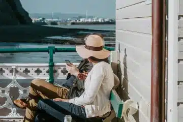 man and woman sitting on bench